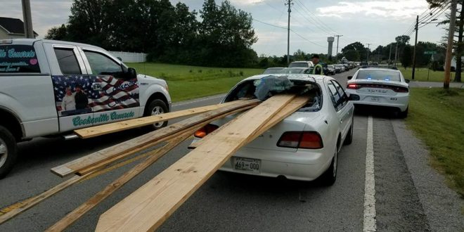 Lumber Smashes Through Windshield; No One Hurt