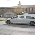 A hearse carrying retired Putnam County Rescue Squad Director Russ Cyphers drives from Hooper Huddleston and Horner Funeral Home, in Cookeville, towards Dodson Chapel Cemetery in Rickman (Photo: Logan Weaver)